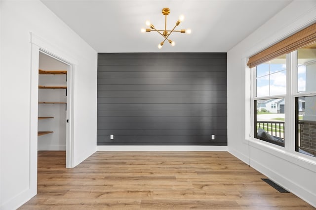 1153 Cedar Springs Dr, Marion, IA 52302 - unfurnished dining area featuring a chandelier and light wood finished floors