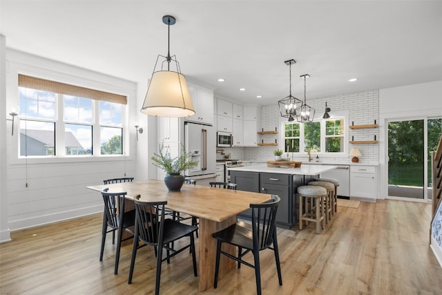 1153 Cedar Springs Dr, Marion, IA 52302 - dining room featuring light wood-type flooring, recessed lighting, and a chandelier