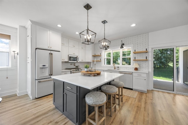 1153 Cedar Springs Dr, Marion, IA 52302 - kitchen featuring stainless steel appliances, open shelves, white cabinetry, tasteful backsplash, and recessed lighting