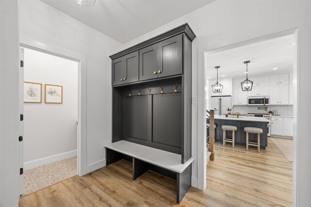 1153 Cedar Springs Dr, Marion, IA 52302 - mudroom with light wood finished floors and recessed lighting