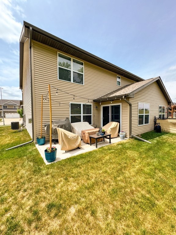 1004 Creekside Dr, Tiffin, IA 52340 - rear view of property with a patio area and a yard