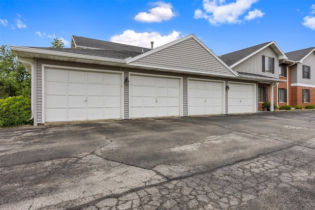 4485 Armar Dr SE Unit 101, Cedar Rapids, IA 52403 - view of front facade featuring a shingled roof and brick siding