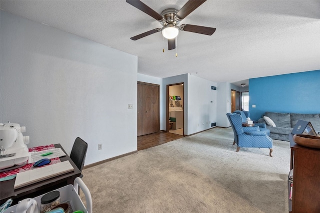 4485 Armar Dr SE Unit 101, Cedar Rapids, IA 52403 - living room featuring carpet flooring, ceiling fan, and a textured ceiling