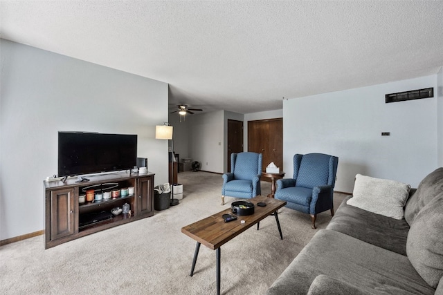 4485 Armar Dr SE Unit 101, Cedar Rapids, IA 52403 - carpeted living area with ceiling fan and a textured ceiling