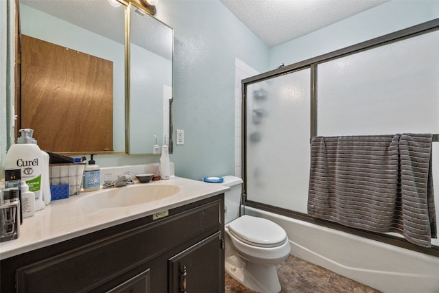 4485 Armar Dr SE Unit 101, Cedar Rapids, IA 52403 - bathroom with vanity, a textured ceiling, and combined bath / shower with glass door