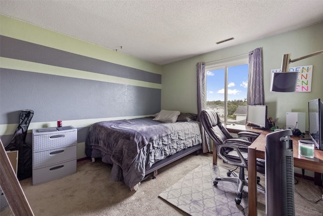 4485 Armar Dr SE Unit 101, Cedar Rapids, IA 52403 - bedroom featuring a textured ceiling, a desk, carpet floors, and a textured wall