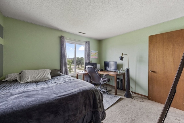 4485 Armar Dr SE Unit 101, Cedar Rapids, IA 52403 - bedroom with light carpet, a textured ceiling, and an office area