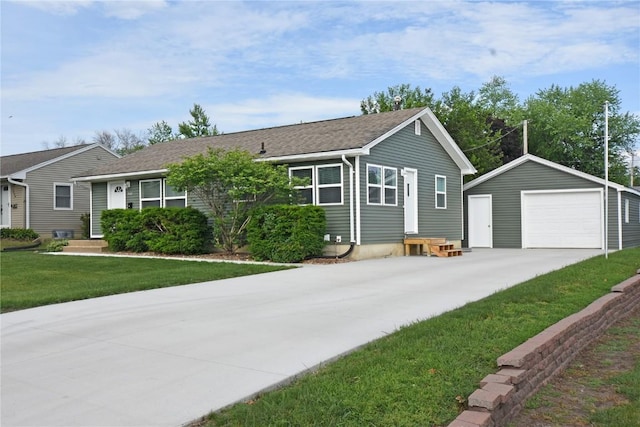 1545 26th St, Marion, IA 52302 - single story home with an outdoor structure, a detached garage, driveway, a front lawn, and entry steps