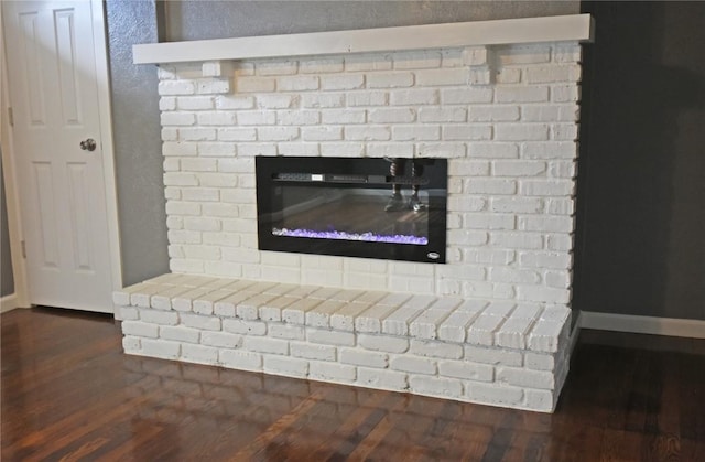 1545 26th St, Marion, IA 52302 - detailed view of a brick fireplace and wood finished floors