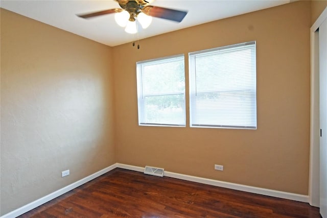 1545 26th St, Marion, IA 52302 - empty room featuring a ceiling fan and dark wood-style floors