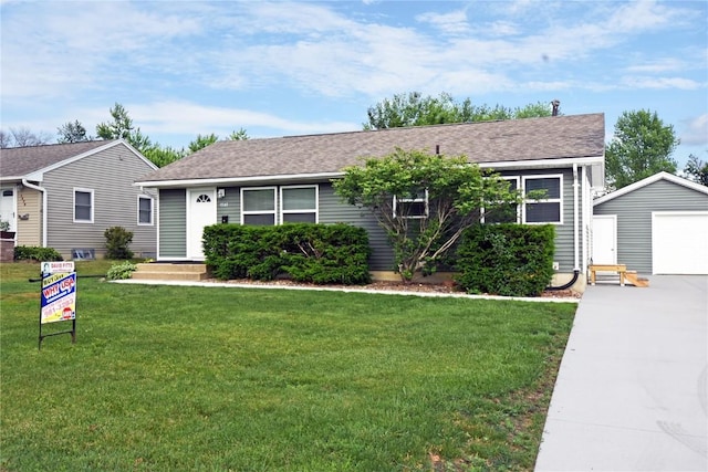 1545 26th St, Marion, IA 52302 - ranch-style home with a garage, driveway, a front yard, an outbuilding, and roof with shingles
