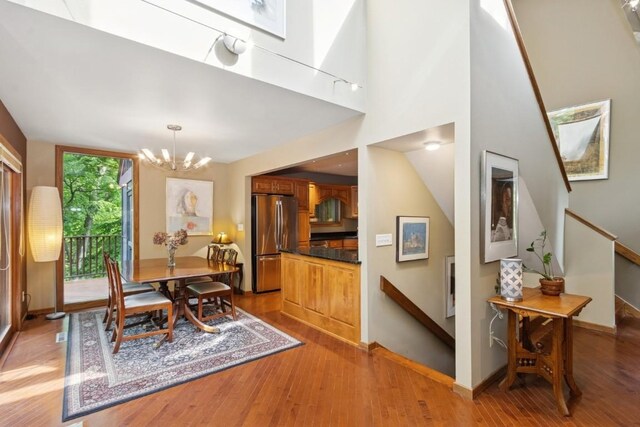 2520 NE Sugar Bottom Rd, Solon, IA 52333 - dining area with a chandelier and light wood finished floors