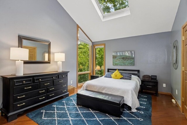 2520 NE Sugar Bottom Rd, Solon, IA 52333 - bedroom featuring wood finished floors, a skylight, and high vaulted ceiling