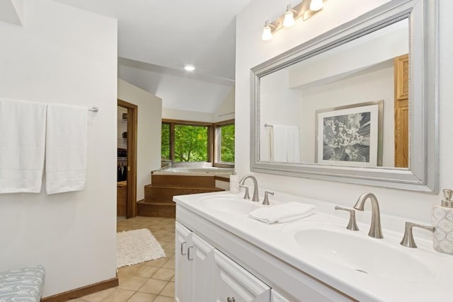 2520 NE Sugar Bottom Rd, Solon, IA 52333 - bathroom with double vanity, tile patterned floors, a garden tub, lofted ceiling, and a walk in closet