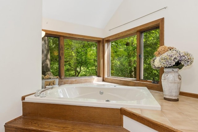 2520 NE Sugar Bottom Rd, Solon, IA 52333 - full bathroom featuring healthy amount of natural light, a bath, vaulted ceiling, and tile patterned floors