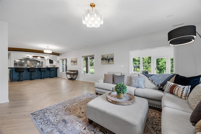 1574 Turkey Ridge Ct NW, Swisher, IA 52338 - living room with a chandelier and baseboards