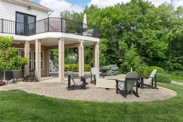 1574 Turkey Ridge Ct NW, Swisher, IA 52338 - view of patio / terrace featuring stairway, an outdoor fire pit, and french doors