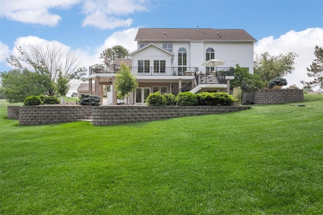 1574 Turkey Ridge Ct NW, Swisher, IA 52338 - back of house featuring stairs, a wooden deck, and a lawn