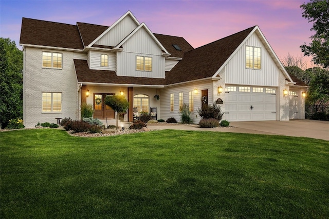 1574 Turkey Ridge Ct NW, Swisher, IA 52338 - modern inspired farmhouse with board and batten siding, a lawn, concrete driveway, and roof with shingles
