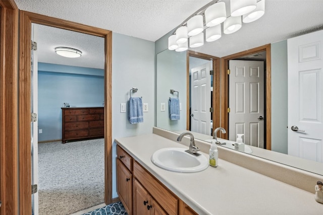 4131 Lakeview Dr SW, Cedar Rapids, IA 52404 - bathroom featuring a textured ceiling and vanity
