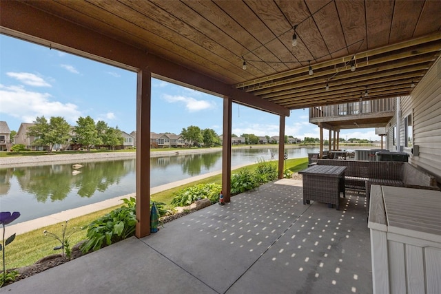 4131 Lakeview Dr SW, Cedar Rapids, IA 52404 - view of patio featuring a water view and a residential view