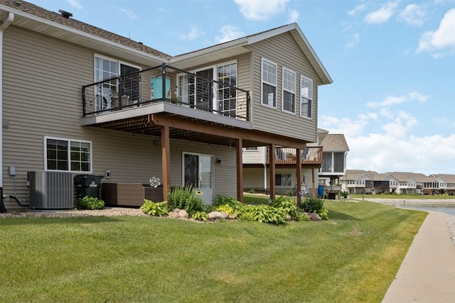4131 Lakeview Dr SW, Cedar Rapids, IA 52404 - rear view of house with a yard and a balcony