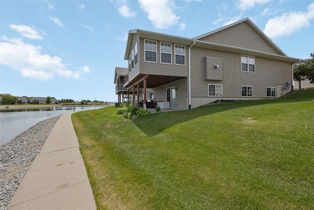4131 Lakeview Dr SW, Cedar Rapids, IA 52404 - view of side of property featuring a water view and a yard