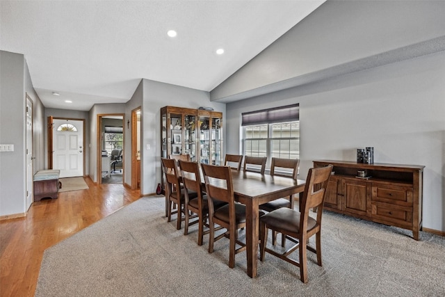 4131 Lakeview Dr SW, Cedar Rapids, IA 52404 - dining room with recessed lighting, vaulted ceiling, and light wood-style flooring