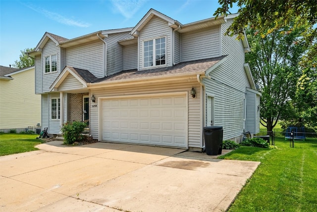 1255 Pacific St, Ely, IA 52227 - view of front of property featuring a front lawn, driveway, roof with shingles, brick siding, and a garage