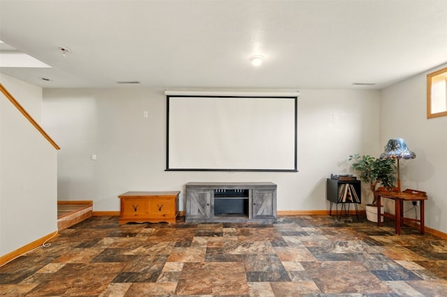1255 Pacific St, Ely, IA 52227 - cinema featuring baseboards and stone finish floors