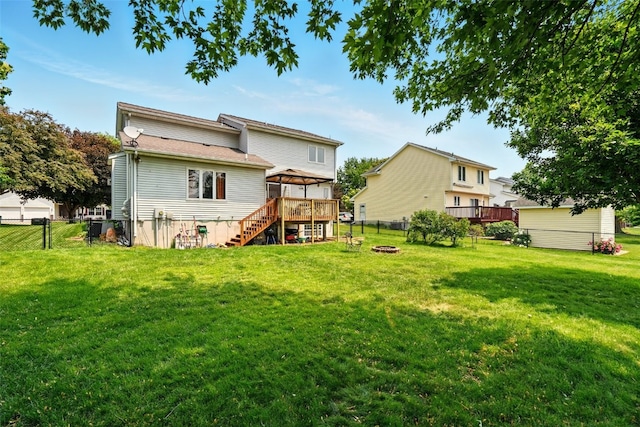 1255 Pacific St, Ely, IA 52227 - back of house with a gazebo, a fire pit, a fenced backyard, stairway, and a deck