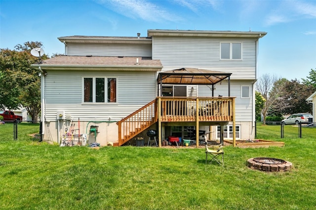 1255 Pacific St, Ely, IA 52227 - rear view of house featuring a gazebo, stairway, a deck, and an outdoor fire pit