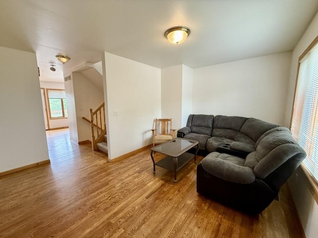 2208 Holiday Rd, Coralville, IA 52241 - living room with light wood finished floors and stairs