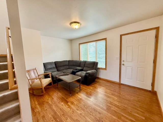 2208 Holiday Rd, Coralville, IA 52241 - living room with light wood finished floors and stairway