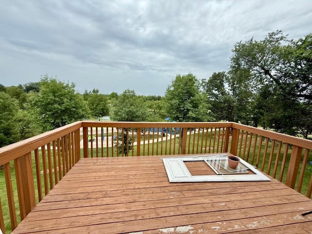 2208 Holiday Rd, Coralville, IA 52241 - deck featuring view of wooded area