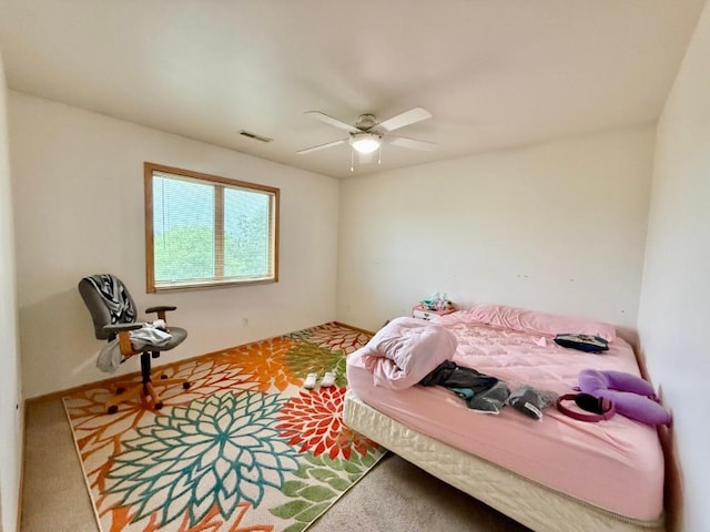 2208 Holiday Rd, Coralville, IA 52241 - carpeted bedroom featuring a ceiling fan