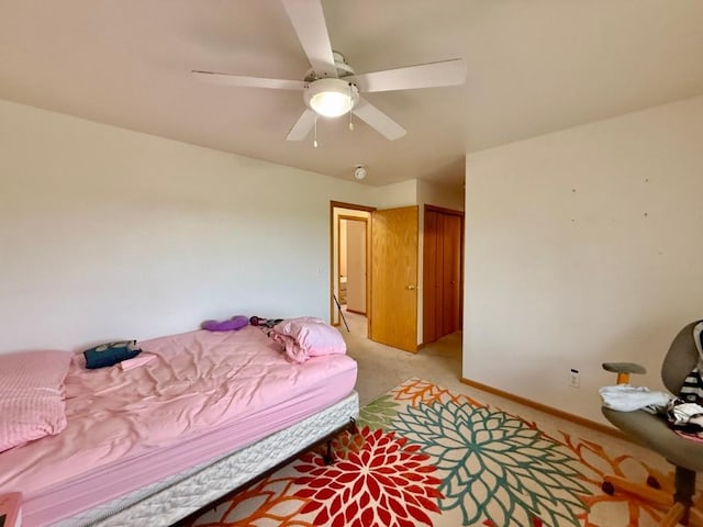 2208 Holiday Rd, Coralville, IA 52241 - bedroom featuring light carpet and a ceiling fan
