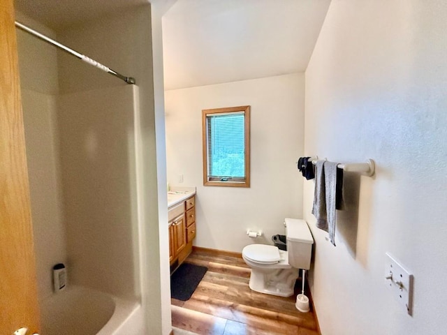 2208 Holiday Rd, Coralville, IA 52241 - full bath featuring wood finished floors, vanity, and shower / bath combination