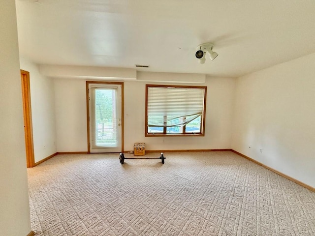 2208 Holiday Rd, Coralville, IA 52241 - carpeted spare room with baseboards