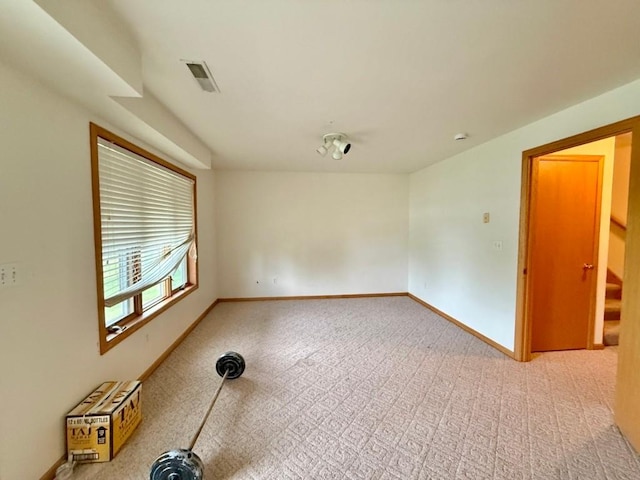 2208 Holiday Rd, Coralville, IA 52241 - empty room featuring light carpet and baseboards
