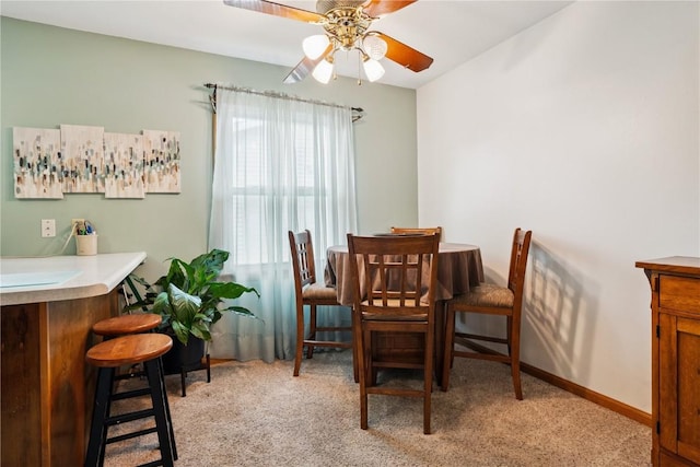 433 Cherry Hill Rd NW, Cedar Rapids, IA 52405 - dining space featuring light colored carpet and a ceiling fan