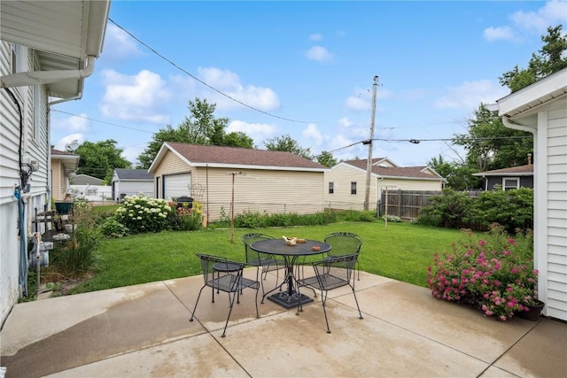 433 Cherry Hill Rd NW, Cedar Rapids, IA 52405 - view of patio / terrace featuring outdoor dining space, a garage, and an outbuilding
