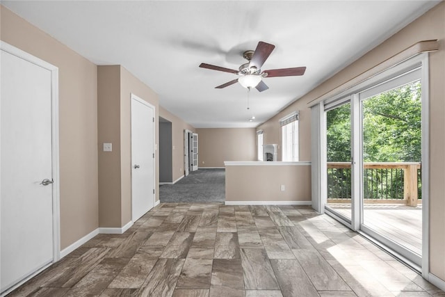 4127 Harwood Dr NE, Cedar Rapids, IA 52411 - spare room featuring ceiling fan and baseboards