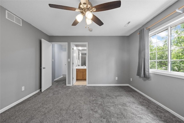 4127 Harwood Dr NE, Cedar Rapids, IA 52411 - unfurnished bedroom with light colored carpet, a ceiling fan, and ensuite bathroom