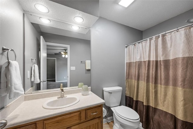 4127 Harwood Dr NE, Cedar Rapids, IA 52411 - full bathroom with a textured ceiling, vanity, a ceiling fan, and curtained shower