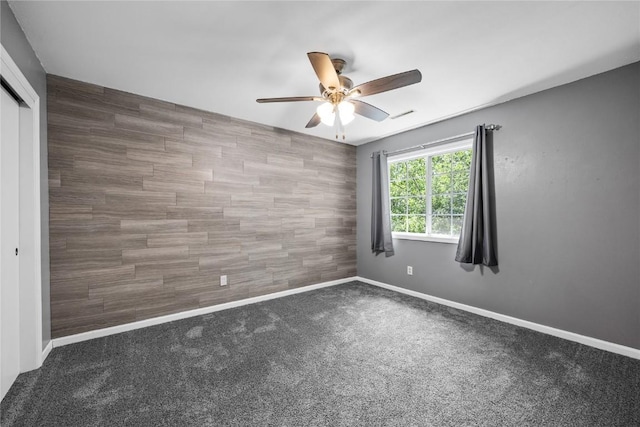 4127 Harwood Dr NE, Cedar Rapids, IA 52411 - carpeted empty room featuring a ceiling fan and baseboards
