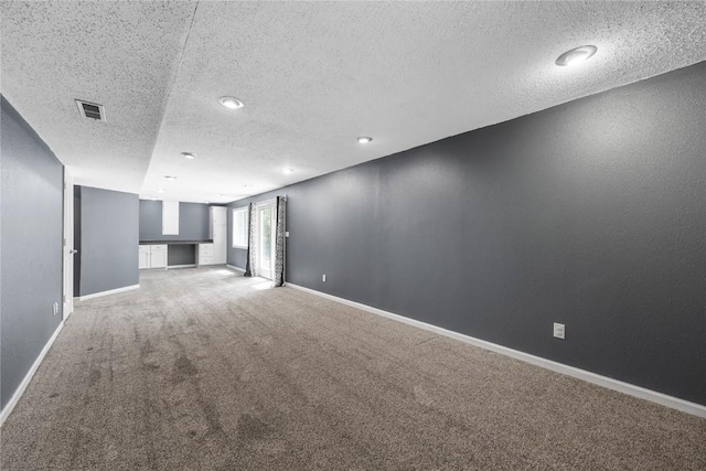 4127 Harwood Dr NE, Cedar Rapids, IA 52411 - carpeted spare room featuring a textured ceiling