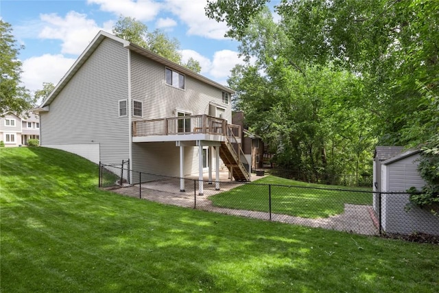 4127 Harwood Dr NE, Cedar Rapids, IA 52411 - rear view of property featuring stairs, a fenced backyard, and a wooden deck