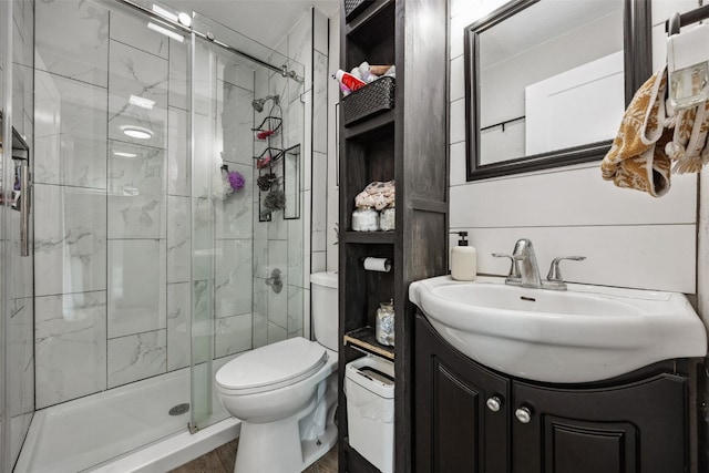 518 Main St, Fairfax, IA 52228 - bathroom with a stall shower, vanity, and wood finished floors
