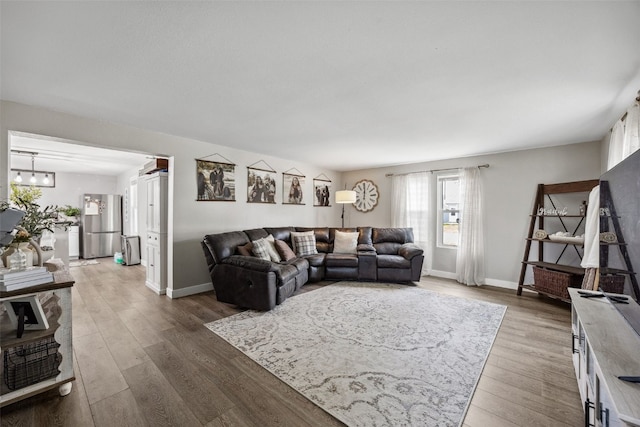 518 Main St, Fairfax, IA 52228 - living area with baseboards and wood finished floors